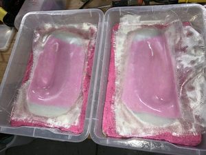 Four layers of fibreglass mat.  Sling advised they use three layers in their mouldings, but I chose to aim for more rigidity.