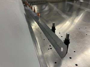 Confirming that skin will lie more or less flat inside the skin.  This will improve with a little forcing and after rivetting.  RH side