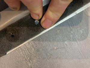 The turps causes the foam to detach, helped along by an edge deburring tool.