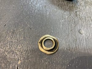 Instead the stepped washer was shaped to sit more closely on the inner surface of the hub. The centre step will ensure the brass tube is centreed in the rather larger hub hole.