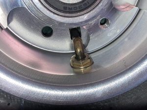 Final result. The nut is not tightened too much so as not to pinch the rubber on the other side too much. This is also why chamfering is important for the nose-wheel in particular. This whole procedure is mostly identical to that used in Pascal Latten's blog.