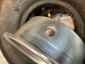 Chamfer applied to 5" nose wheel hub valve tube hole, to prevent chafing against the inner tube