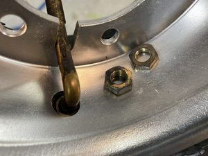 There are two nuts provided. Only the thinner nut is used.