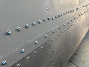 Epoxy filling of fuselage and wing rivets - We Build Planes