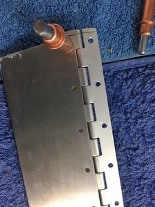 This guard was inserted along with the hinge and the edges of the notches of the hinge lined up with the edge of the skin flat. Mismatch between the skin and hinge holes could then be drilled out, the mdf protecting the lower jaw of the skin