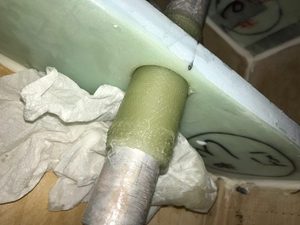 Making bearings using four inch glass tape.. I covered the flap actuating rod with several coats of Mother's car wax and then wrapped the tube in cellophane just for good measure. One thing you don't want to happen is to have that damned rod stuck in place because you will never get it free.