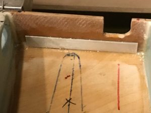Undressed cutout of flap control linkage.