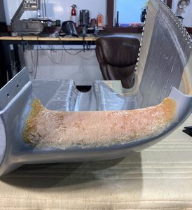 Initial sanding of the dried flox to match the previous intake contour..