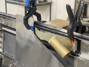 Using clamps to hold pieces together until the SikaFlex cures out.